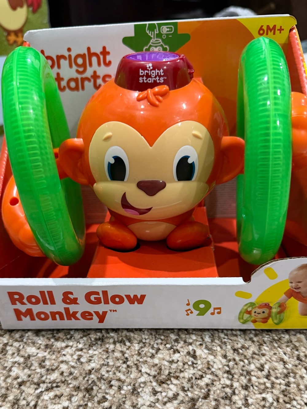 Bright Starts Orange Monkey Toy with Green Light-Up Rings